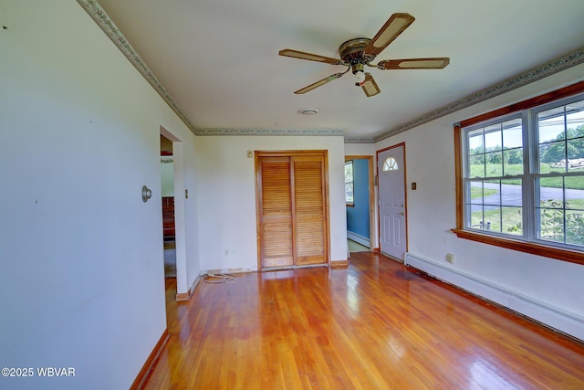 443 Derr Hill Rd, Lock Haven, PA 17745 - entrance foyer with a baseboard radiator, light wood-style flooring, a ceiling fan, baseboards, and ornamental molding