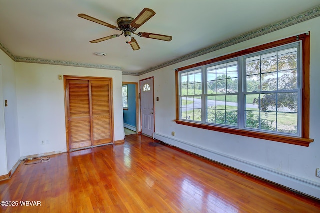 443 Derr Hill Rd, Lock Haven, PA 17745 - foyer featuring a baseboard heating unit, baseboards, ceiling fan, and wood finished floors