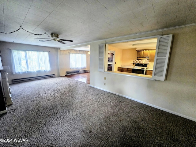 unfurnished living room with ceiling fan, baseboard heating, carpet flooring, and baseboards