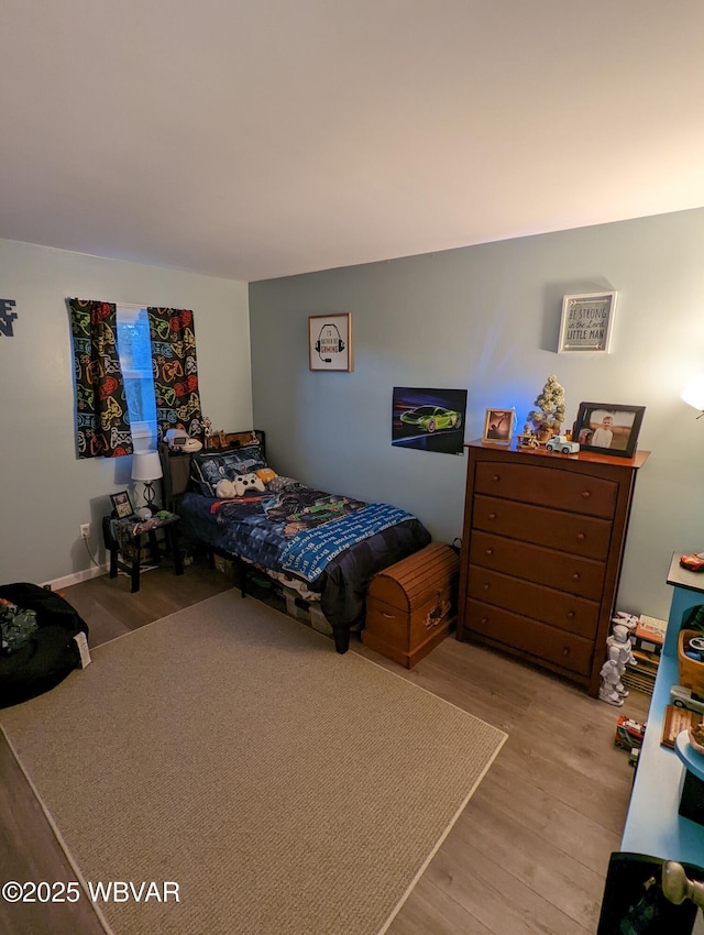 bedroom featuring light wood-style floors