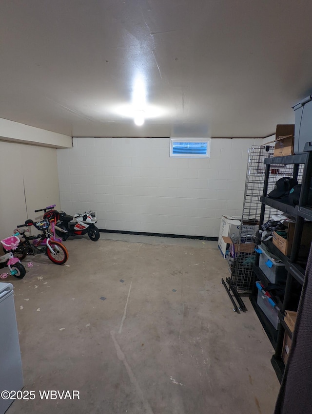 garage featuring concrete block wall