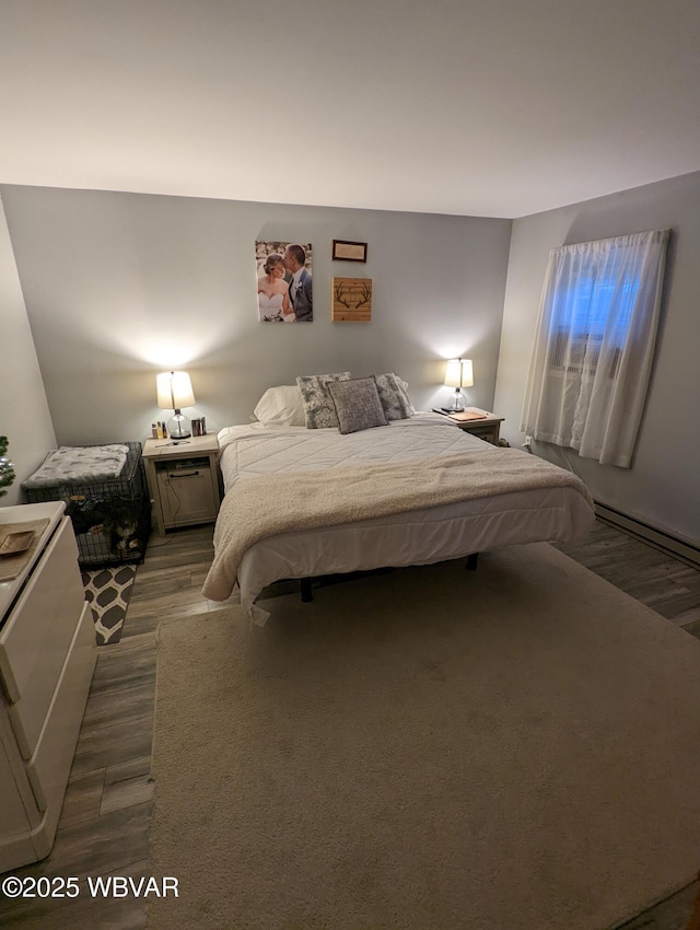 bedroom featuring a baseboard radiator and dark wood-type flooring