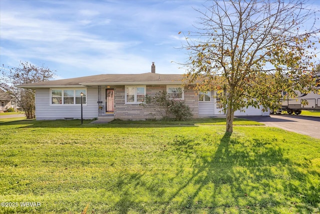 ranch-style home with a garage and a front yard