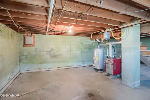 basement featuring water heater and electric panel