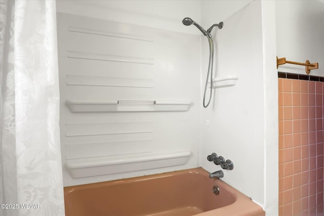 bathroom featuring shower / bath combo with shower curtain and tile walls