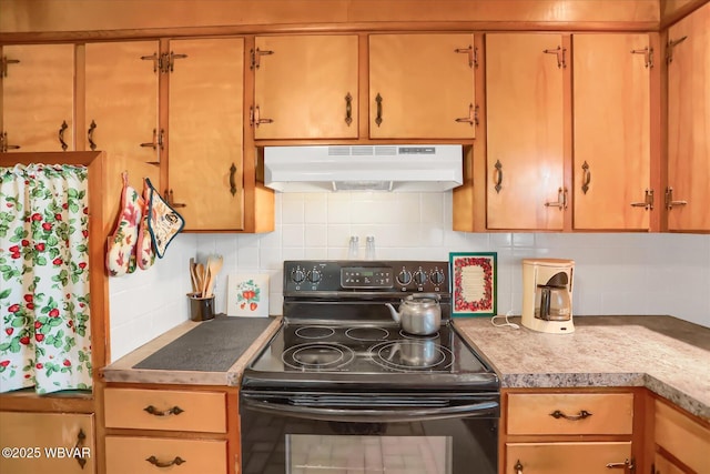 kitchen featuring tasteful backsplash and electric range