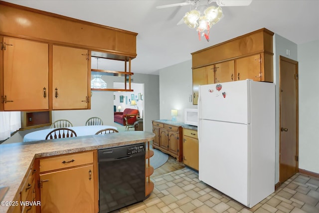 kitchen featuring white appliances, kitchen peninsula, and ceiling fan