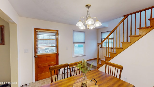 599 E Academy St, Hughesville, PA 17737 - dining room with stairs and a notable chandelier