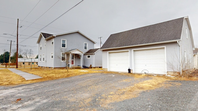 599 E Academy St, Hughesville, PA 17737 - view of front facade featuring a garage and roof with shingles