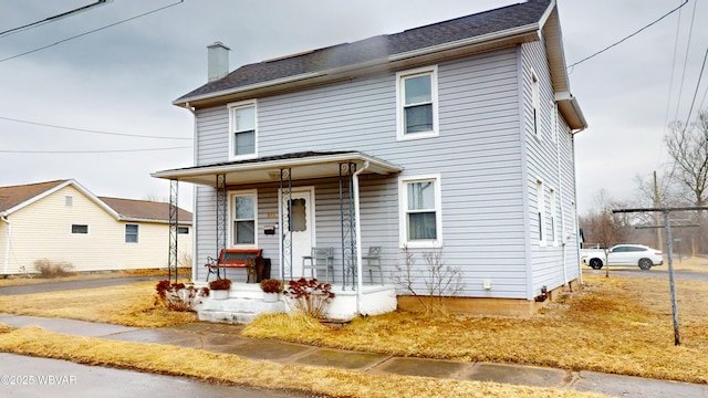599 E Academy St, Hughesville, PA 17737 - view of front of home featuring a porch and a chimney