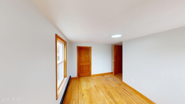599 E Academy St, Hughesville, PA 17737 - empty room featuring light wood finished floors, baseboards, and baseboard heating