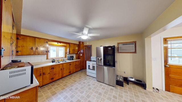 599 E Academy St, Hughesville, PA 17737 - kitchen featuring white electric stove, a sink, a wall mounted AC, stainless steel refrigerator with ice dispenser, and brown cabinetry