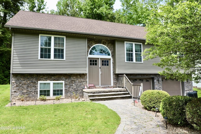 82 Woodside Cir, Jersey Shore, PA 17740 - split foyer home with stone siding, a front yard, and a shingled roof