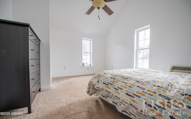 bedroom featuring ceiling fan, high vaulted ceiling, light carpet, baseboards, and an AC wall unit