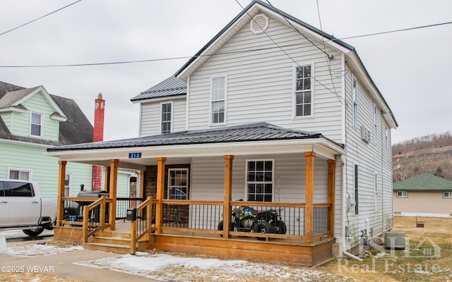 view of front of home featuring covered porch and metal roof