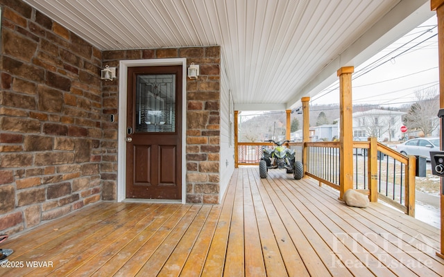 wooden terrace featuring a porch