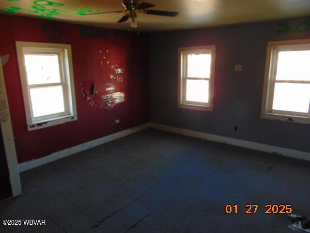 spare room with ceiling fan