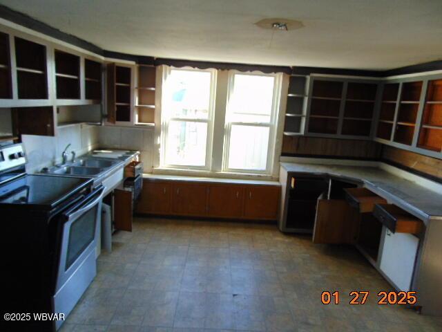 kitchen with sink and stainless steel electric range