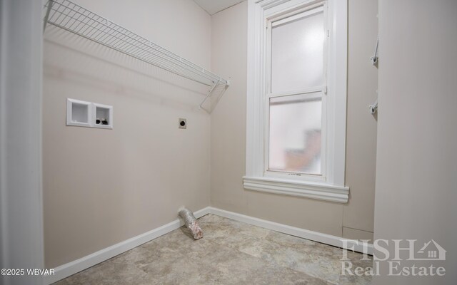 clothes washing area featuring laundry area, hookup for a washing machine, electric dryer hookup, and baseboards