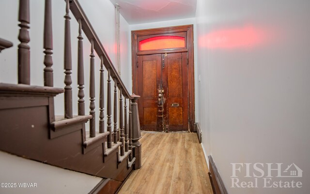 foyer with stairs and light wood-type flooring