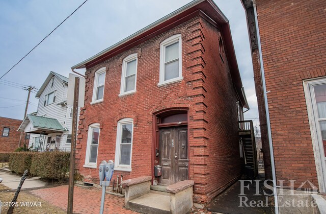 view of property with brick siding