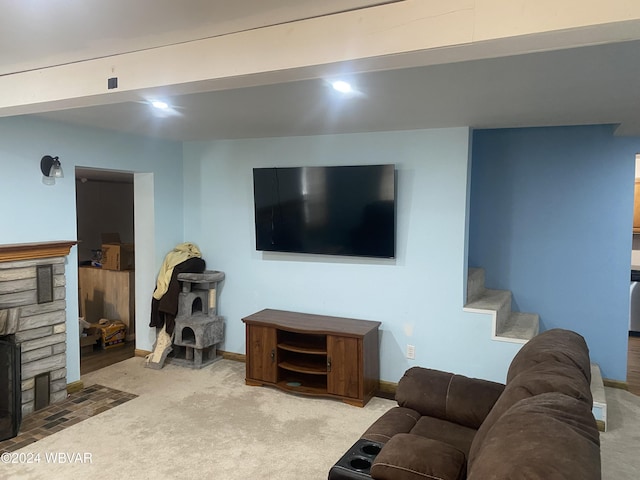 living room with a fireplace and light carpet