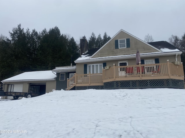 view of front of house with a garage and a wooden deck