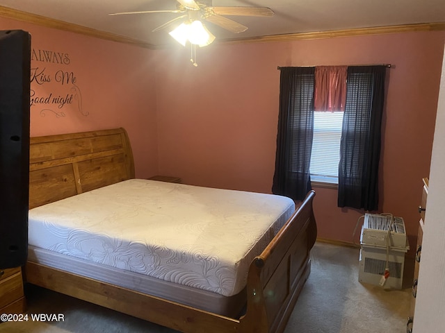 carpeted bedroom with ceiling fan and crown molding