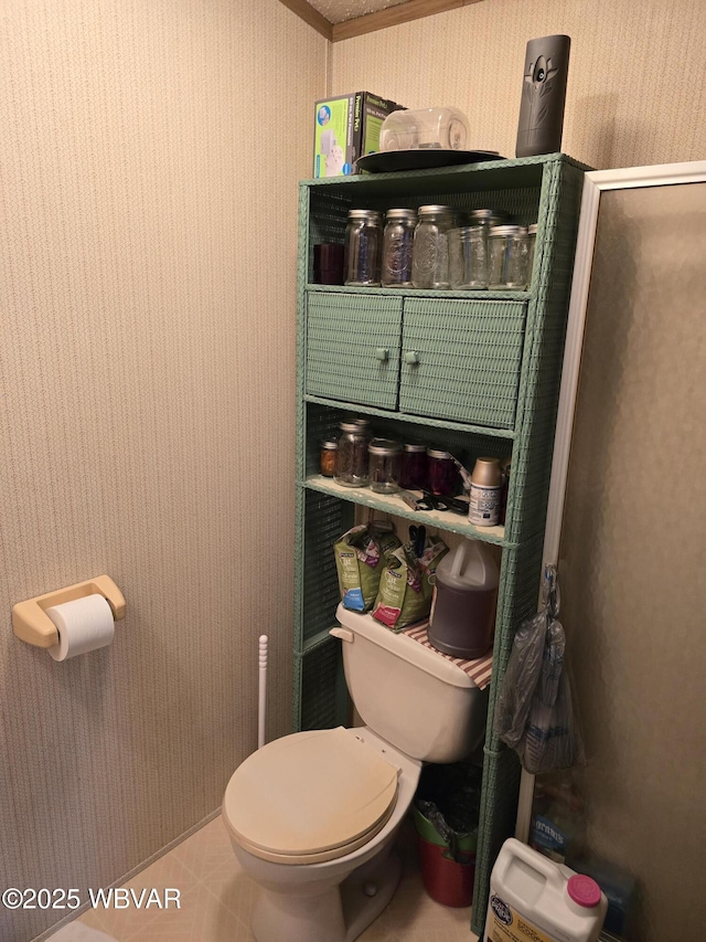 bathroom with tile patterned floors and toilet