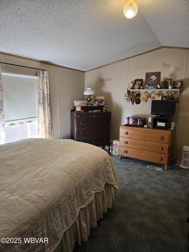 bedroom with ornamental molding, lofted ceiling, a textured ceiling, and dark colored carpet