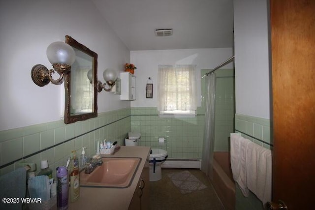 1714 Princeton Ave, Williamsport, PA 17701 - full bathroom with tile walls, baseboard heating, toilet, wainscoting, and vanity
