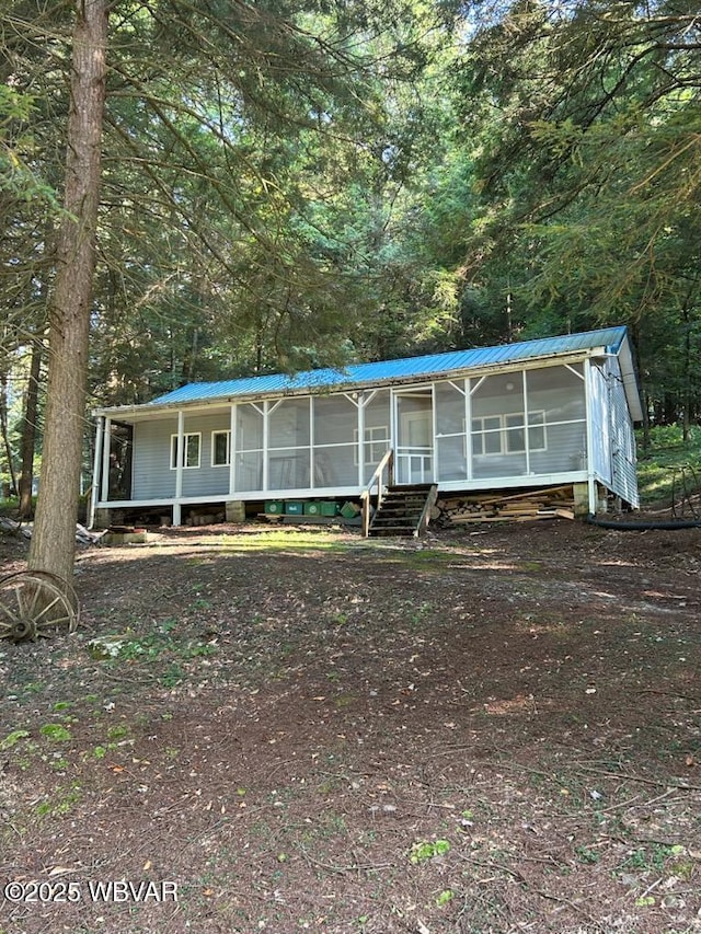 manufactured / mobile home with a sunroom and metal roof