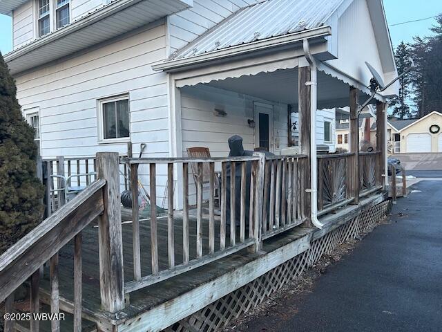 view of property exterior with a porch