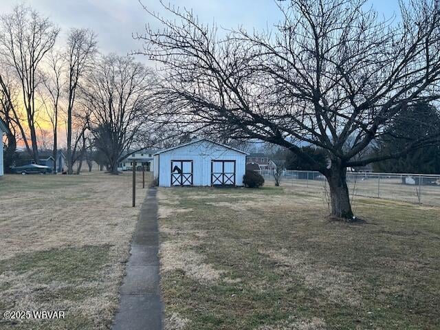 yard at dusk with a shed