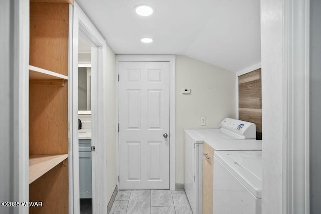 clothes washing area with recessed lighting, baseboards, washer and clothes dryer, and marble finish floor
