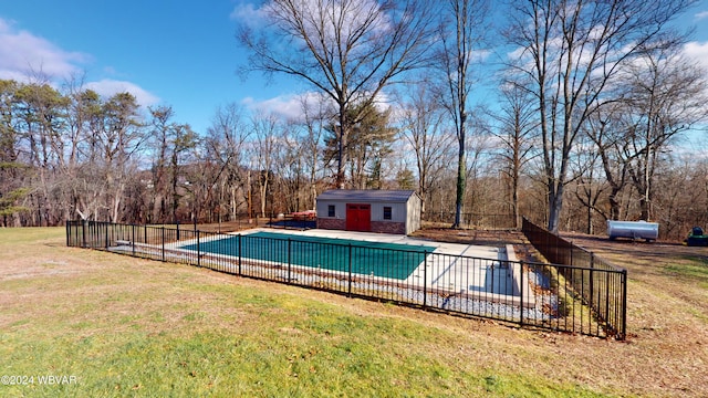 view of swimming pool with a yard and an outdoor structure