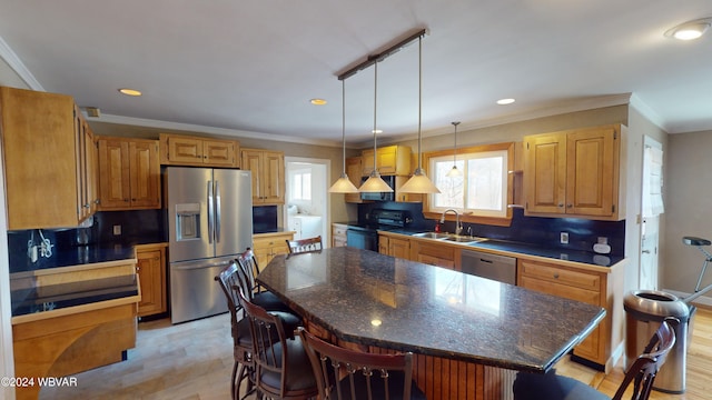 kitchen with decorative backsplash, a center island, light wood-type flooring, and stainless steel appliances