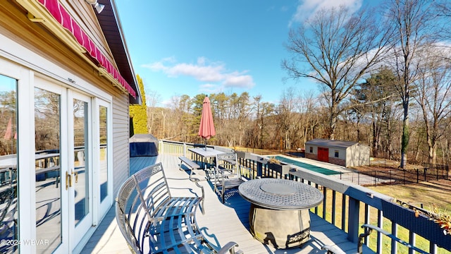 deck featuring a storage shed