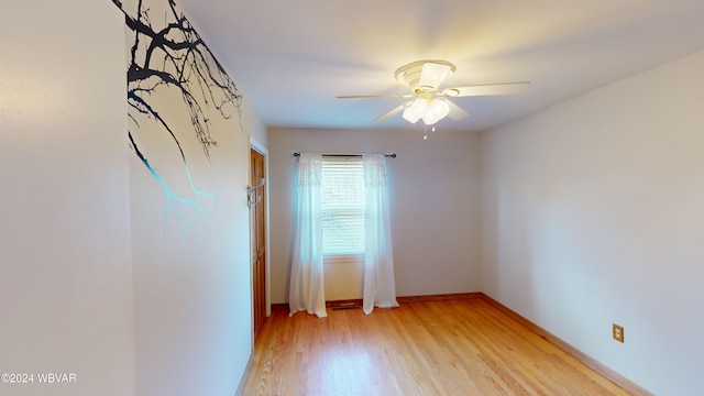 empty room featuring ceiling fan and light wood-type flooring