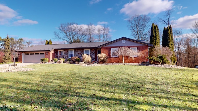 single story home featuring a garage and a front lawn