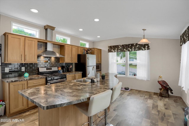 212 Sanctuary Blvd, Lock Haven, PA 17745 - kitchen with stainless steel appliances, wall chimney exhaust hood, a kitchen bar, a kitchen island with sink, and backsplash