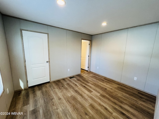 unfurnished bedroom featuring wood-type flooring