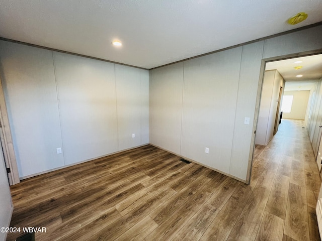 spare room featuring hardwood / wood-style floors