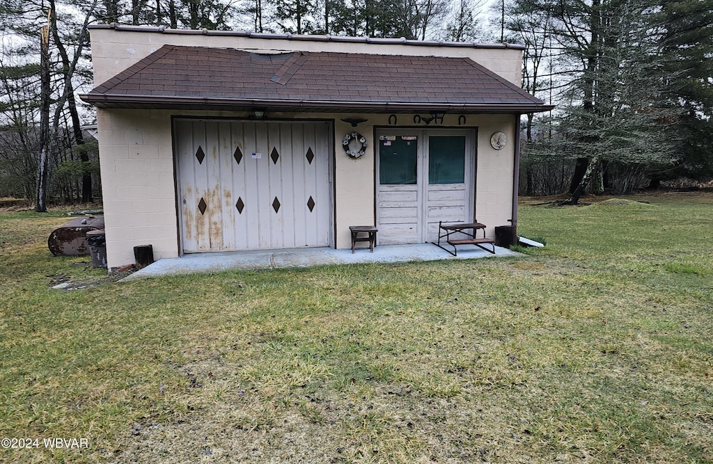 view of outbuilding with a lawn