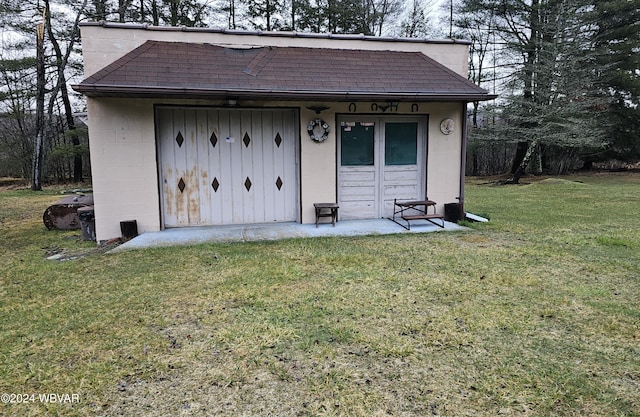 view of outbuilding with a lawn