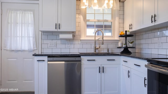 1945 Eagle Valley Rd, Beech Creek, PA 16822 - kitchen with appliances with stainless steel finishes, backsplash, white cabinetry, and plenty of natural light