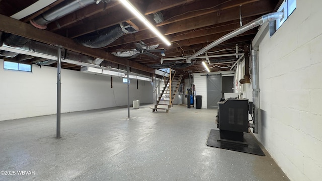 1945 Eagle Valley Rd, Beech Creek, PA 16822 - basement with concrete block wall, stairway, and a heating unit