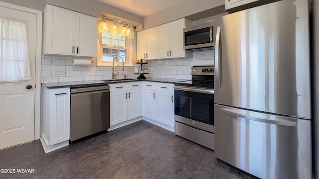 1945 Eagle Valley Rd, Beech Creek, PA 16822 - kitchen featuring appliances with stainless steel finishes, decorative backsplash, and white cabinetry