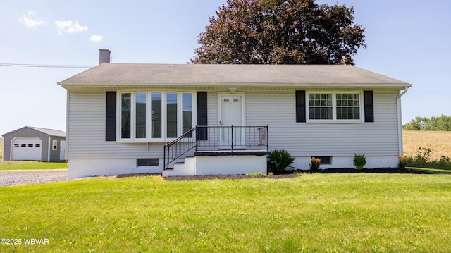 1945 Eagle Valley Rd, Beech Creek, PA 16822 - view of front of home with a chimney, a front yard, a detached garage, and an outbuilding