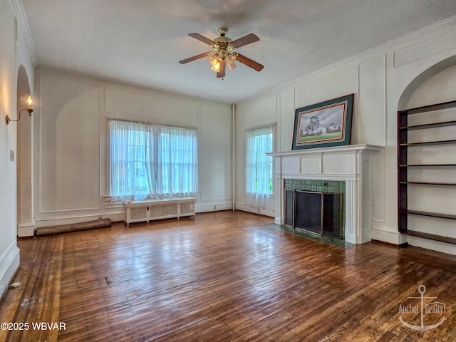 345 W Main St, Lock Haven, PA 17745 - unfurnished living room featuring radiator heating unit, a decorative wall, crown molding, hardwood / wood-style floors, and ceiling fan